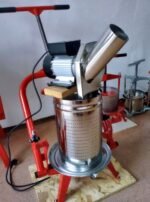 Electric apple crusher on the fruit press